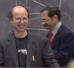 Bouncing: Frank Wilczek smiling at Betsy Devine, whose hair is the blob in lower righthand corner.<br />“><br />
Who is the person literally bouncing up and down during the standing<br />
ovation for Frank Wilczek?  (About 3 and a half minutes into the <a href=