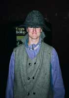 FalunGuide: Guide at the Falun Copper Mine, wearing thick felt traditional hat on top of his hard hat.