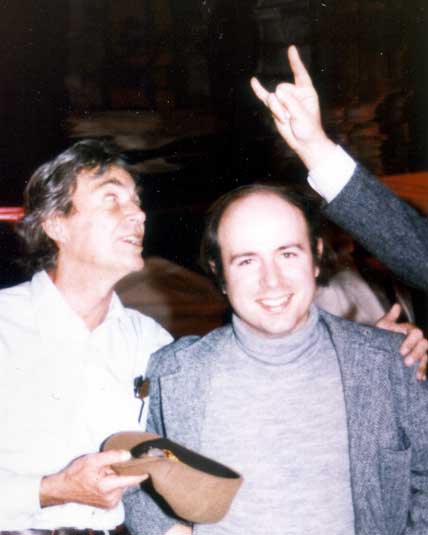 FeynmanWilczek: Richard Feynman with Frank Wilczek, at Murph Goldberger's 60th birthday party, 1983, "devil horns" by Sam Treiman.