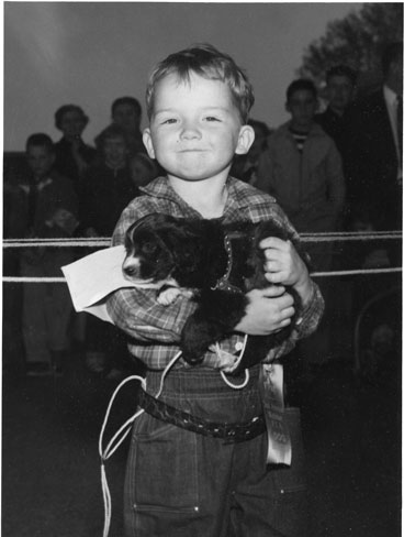 MarkPuppy: Mark Devine, age 6, holding puppy and first-prize ribbon