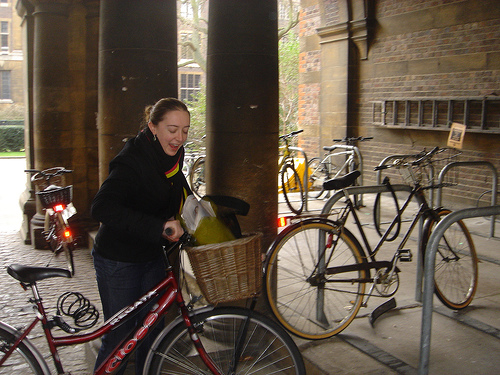 SportUtilityBike: Zoe with bicycle, laughing, in Cambridge, UK
