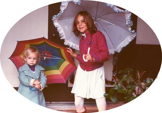 Mira and Amity with umbrellas, December 1984